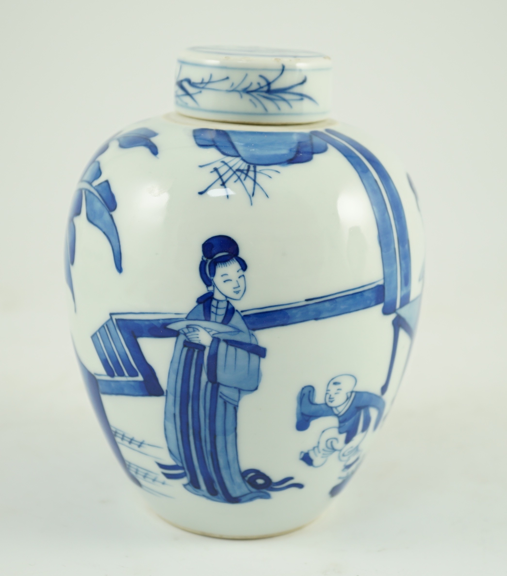 A Chinese blue and white jar and cover, probably Kangxi period, 15 cms high, 14.8cm high, small glaze losses to cover